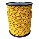 Spool of yellow rope with red accents on a white background