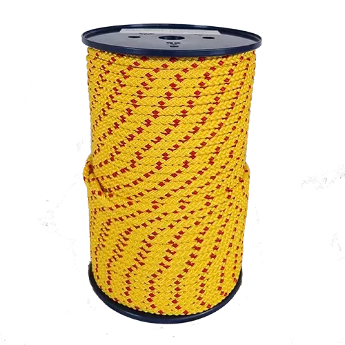 Spool of yellow rope with red pattern on a white background
