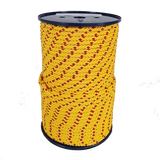 Spool of yellow rope with red pattern on a white background