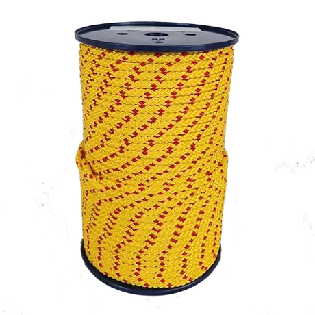 Spool of yellow rope with red pattern on a white background